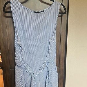 Ann Taylor classic style.  Sleeveless Blouse with tie at peplum waist.